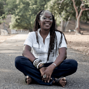 lesley-ann noel Dr. Lesley-Ann Noel smiling and sitting in front of trees.