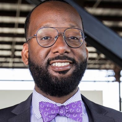 Blake Stanfill smiling and wearing a purple bowtie.