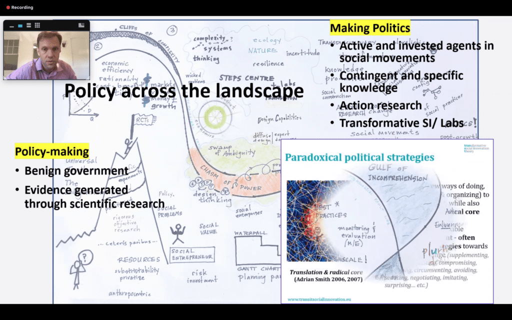 Screenshot of a zoom presentation with a man speaking and a slide that says 